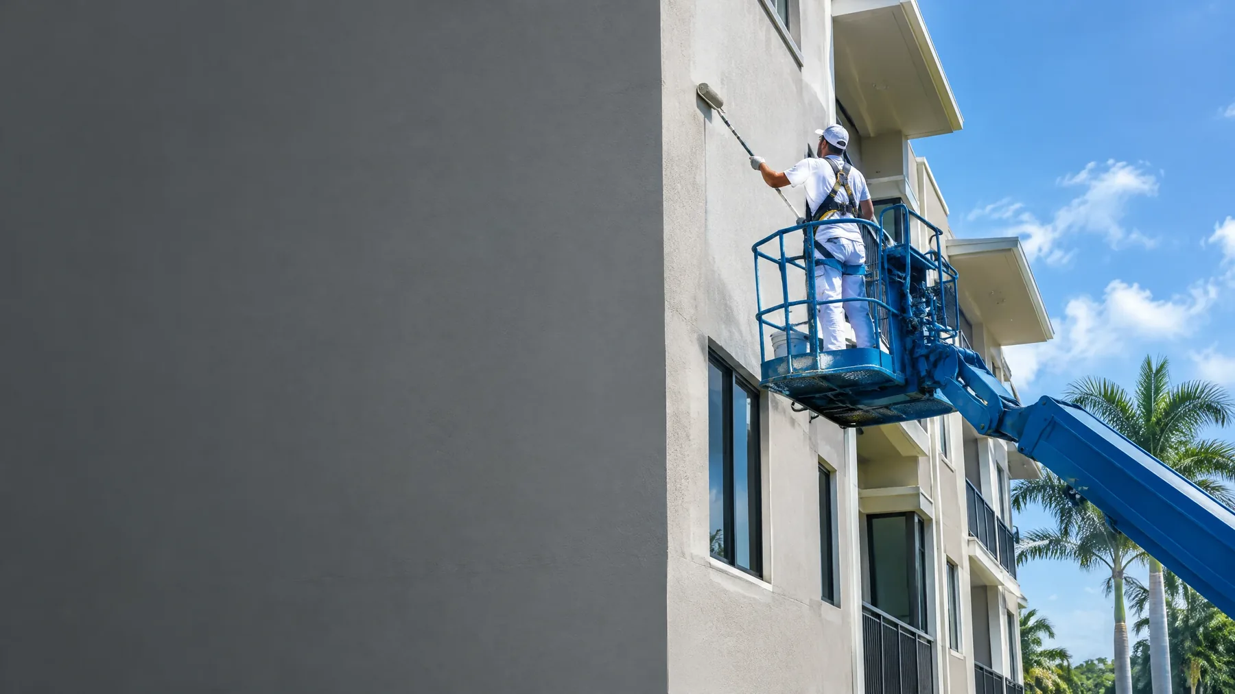commercial painting example — condo exterior repaint from a lift in South Florida