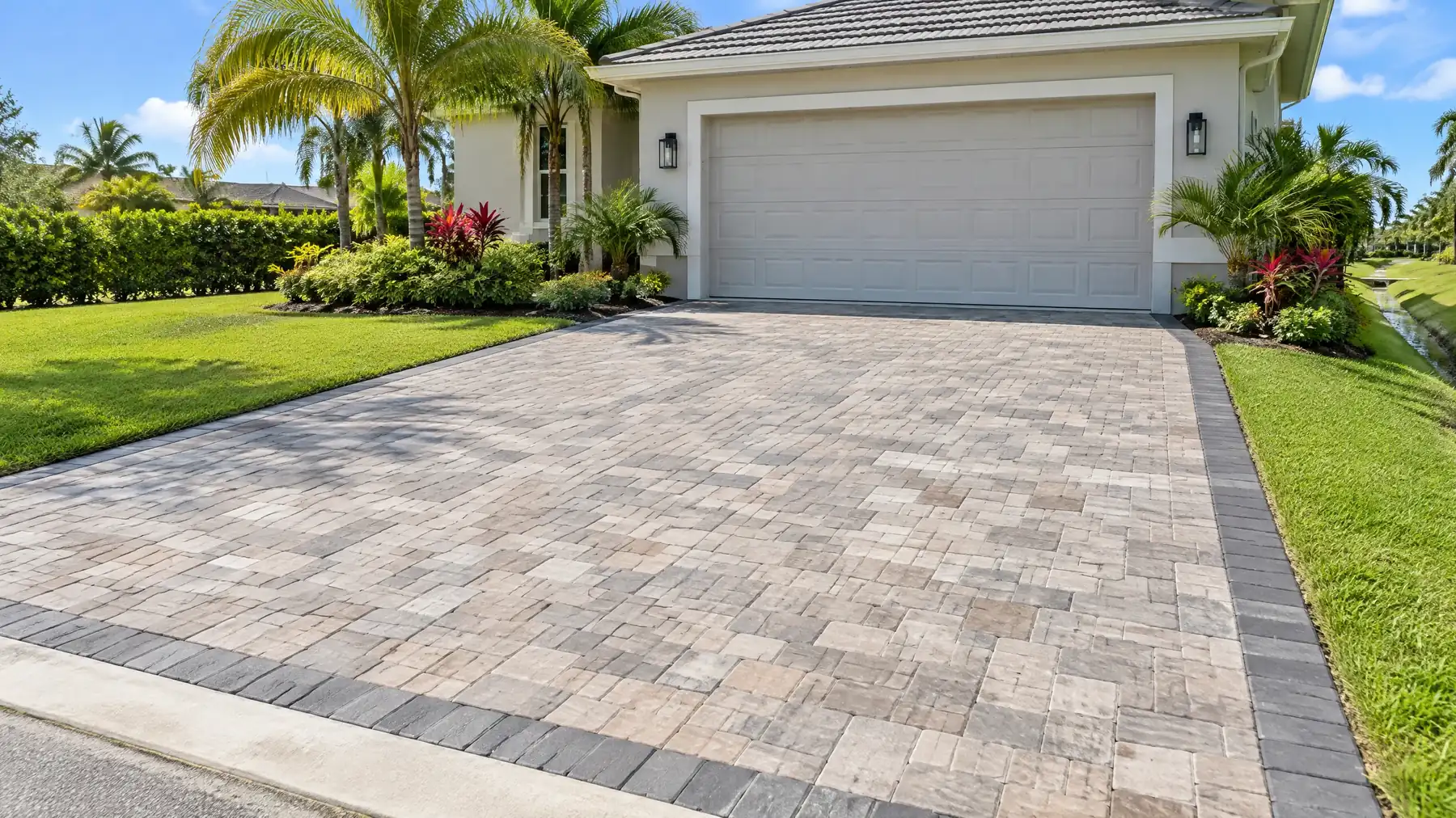 paver driveway example — concrete pavers with soldier-course border and apron