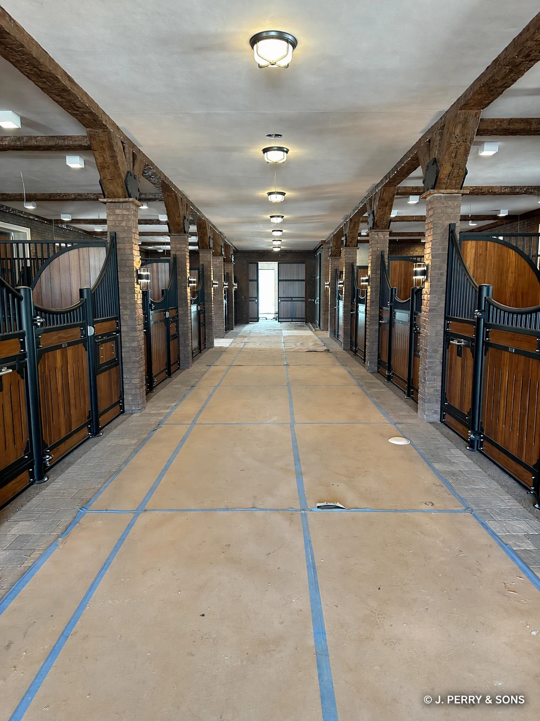 Protected aisle inside the Southwest Ranches equestrian stable renovation
